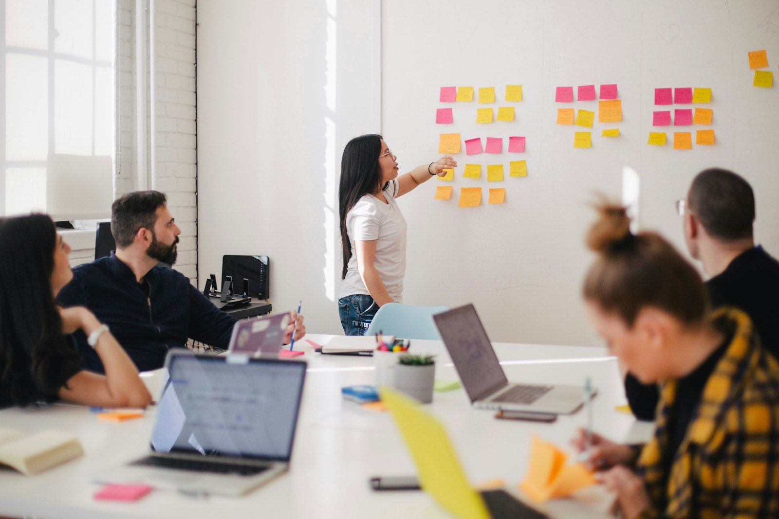 IT team reviewing cybersecurity and cloud budget plans in a modern office